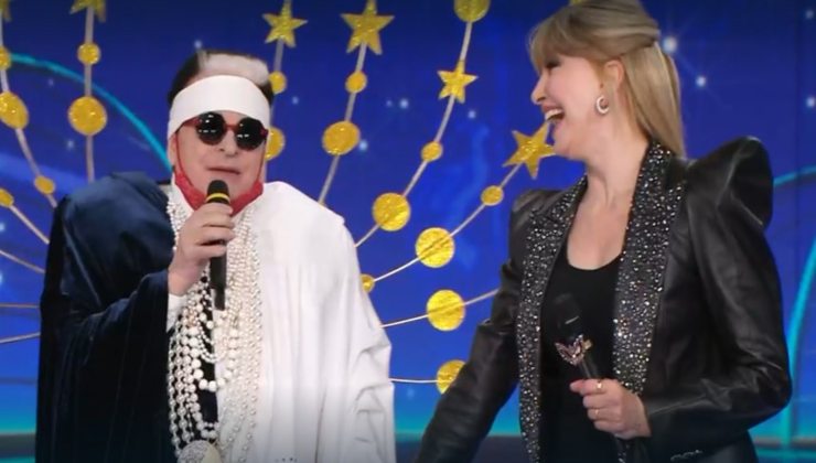 Cristiano-Malgioglio-e-Milly-Carlucci-Il-Cantante-Mascherato-Altranotizia